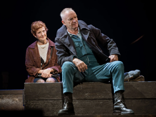 Peggy and Jackie White sit side by side on wooden staging, not quite looking at each other.
